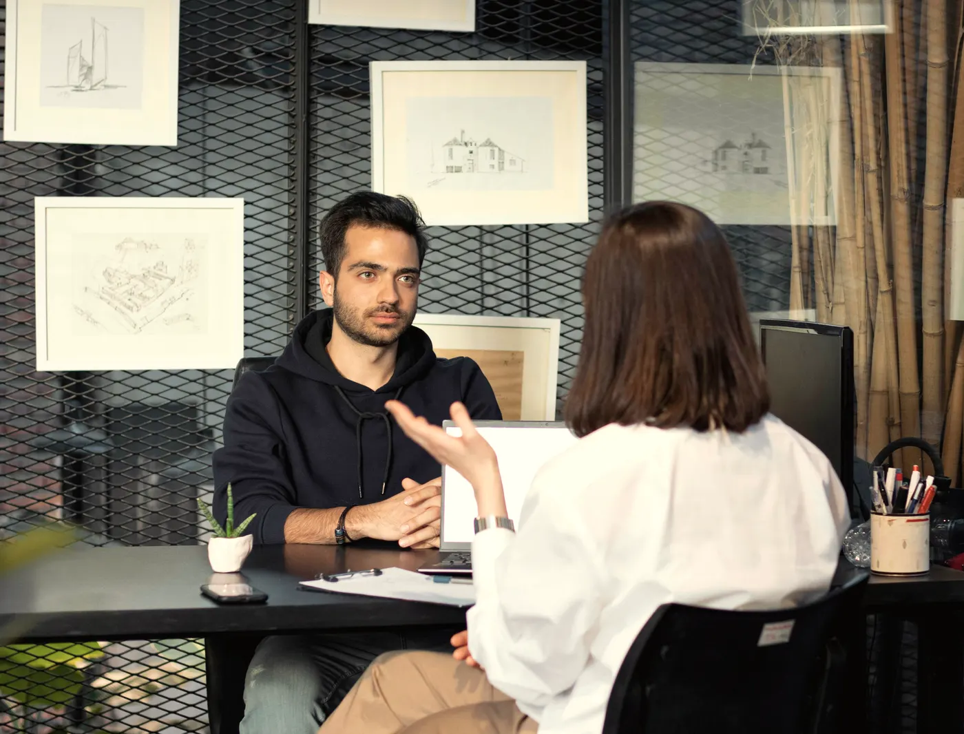 An interview across a desk.