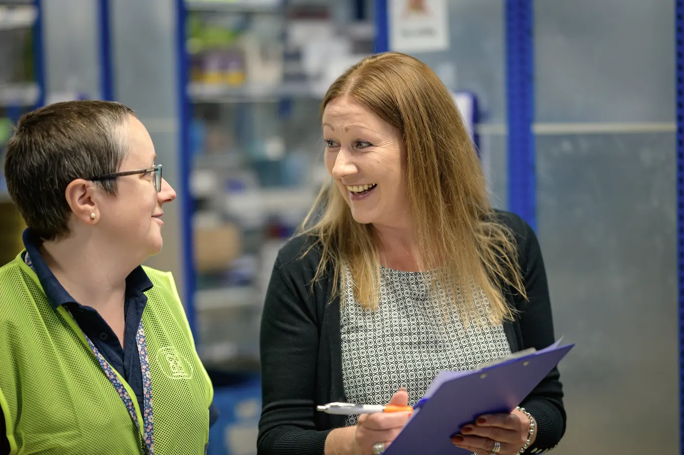 A supervisor checks in with a colleague on site.